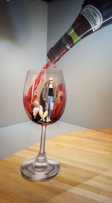 Two ladies in a glass of wine. An optical illusion in Melbourne