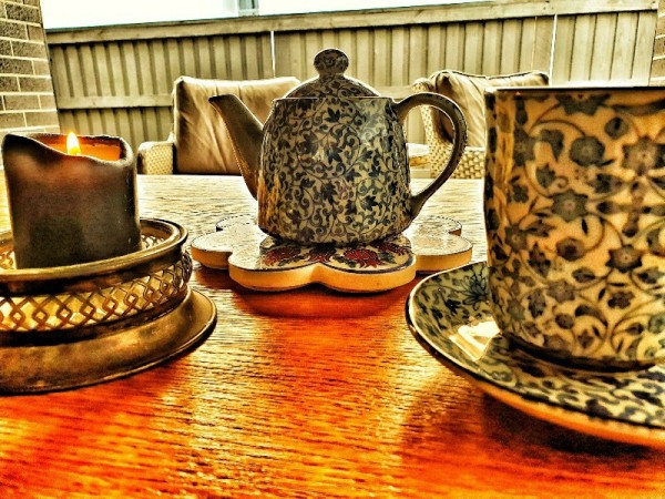 teapot with teacups and candle